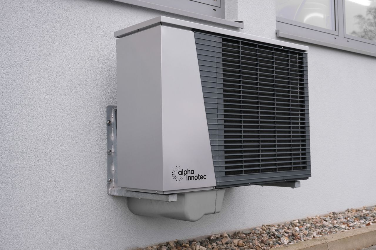 The Art of Drawing Readers In: Your attractive post title goes here Outdoor air conditioning unit mounted on a residential building exterior.