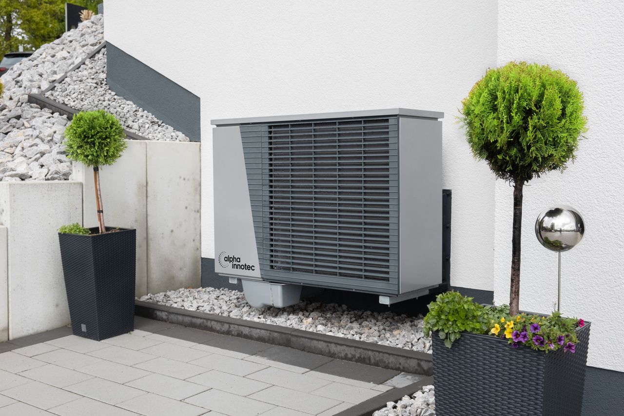 services-03 Modern air conditioning unit with flower pots and sleek decor outdoors.